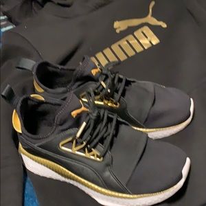 Puma women’s 9 Kylie Jenner black/gold